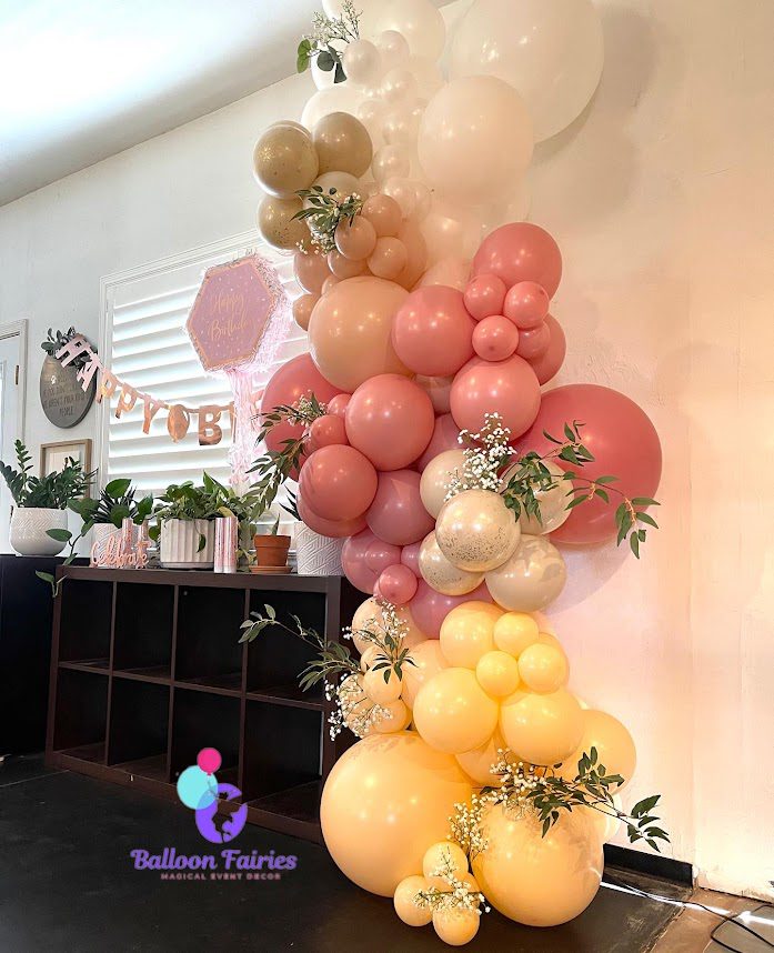 A pink and yellow color balloon design